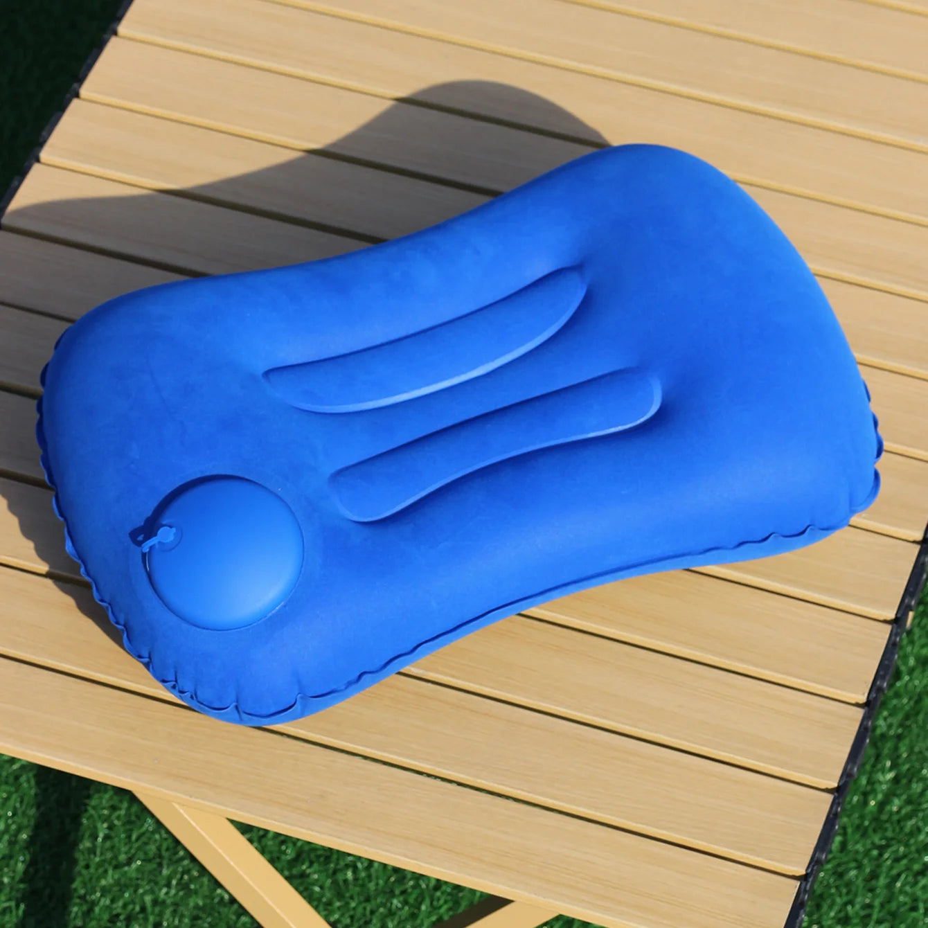 Automatic press - to - inflate pillow